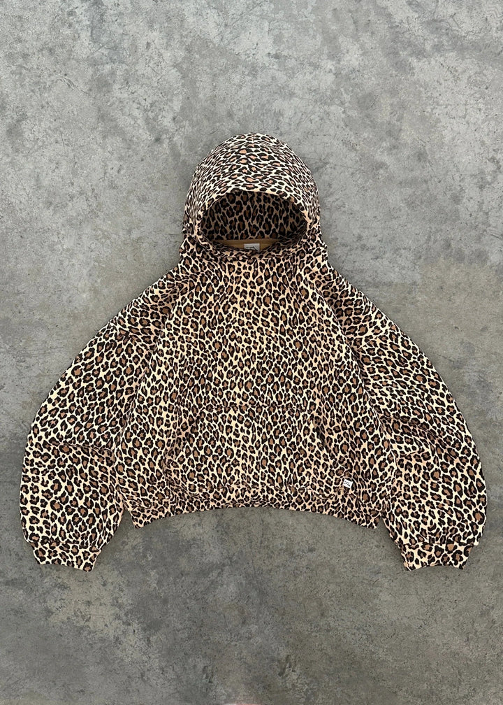 Leopard print oversized hoodie with hood, laid flat on concrete surface | Grace Aura