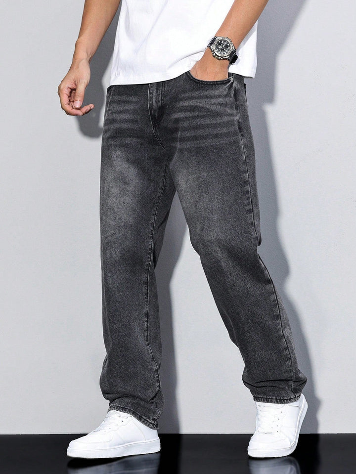 Man wearing gray washed straight-leg denim jeans with white sneakers, side view | Grace Aura