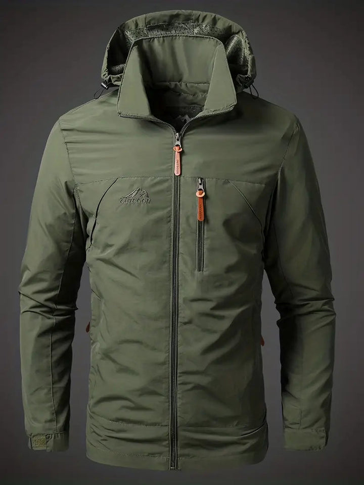 Olive green hooded zip-up windbreaker jacket worn by a man | Grace Aura