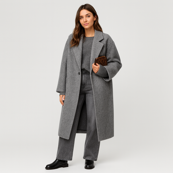 Woman wearing gray oversized wool coat, sweater, and jeans outfit | Grace Aura