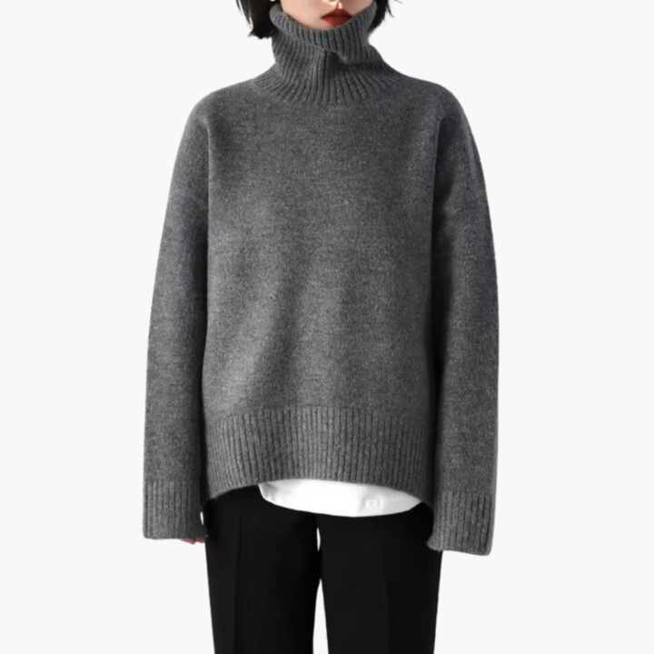 Gray turtleneck knit sweater worn by woman with black trousers | Grace Aura
