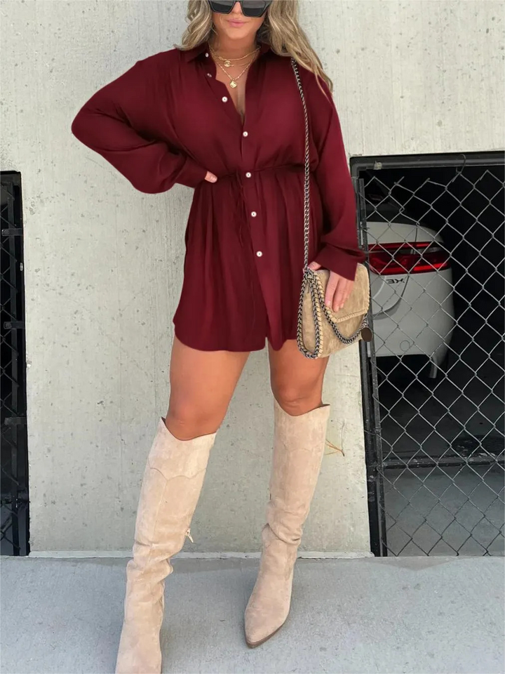 Woman wearing burgundy button-up shirt dress with tall beige suede boots | Grace Aura