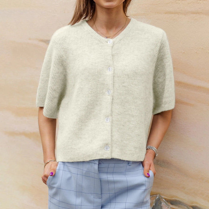 Pale green ribbed knit cardigan, short sleeves, worn by woman | Grace Aura