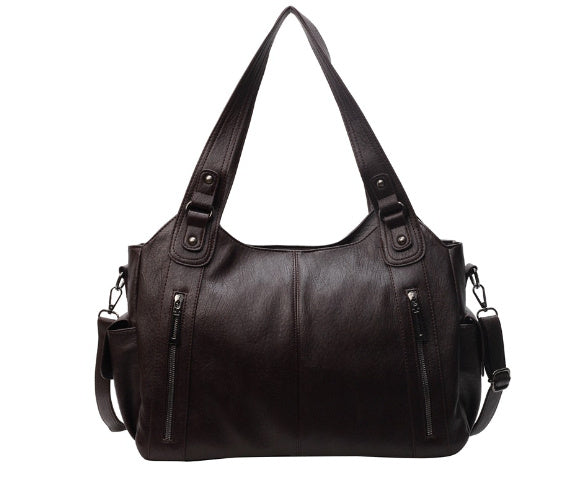 Dark brown leather shoulder bag with zip pockets, shown flat, no model | Grace Aura
