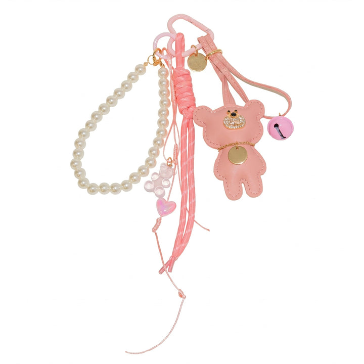 Pink teddy bear bag charm with pearl beads and cord, flat lay | Grace Aura