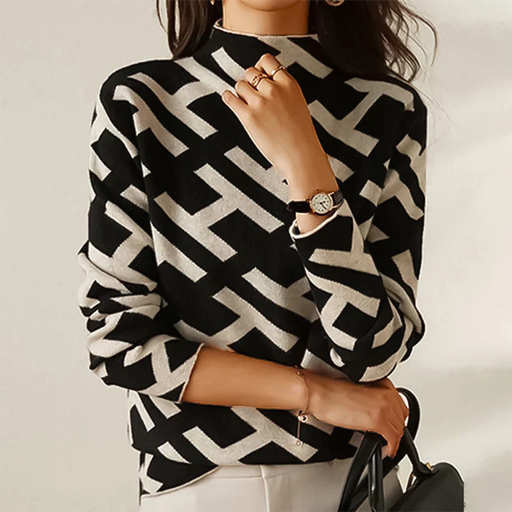 Black and white geometric knit turtleneck sweater worn by woman | Grace Aura