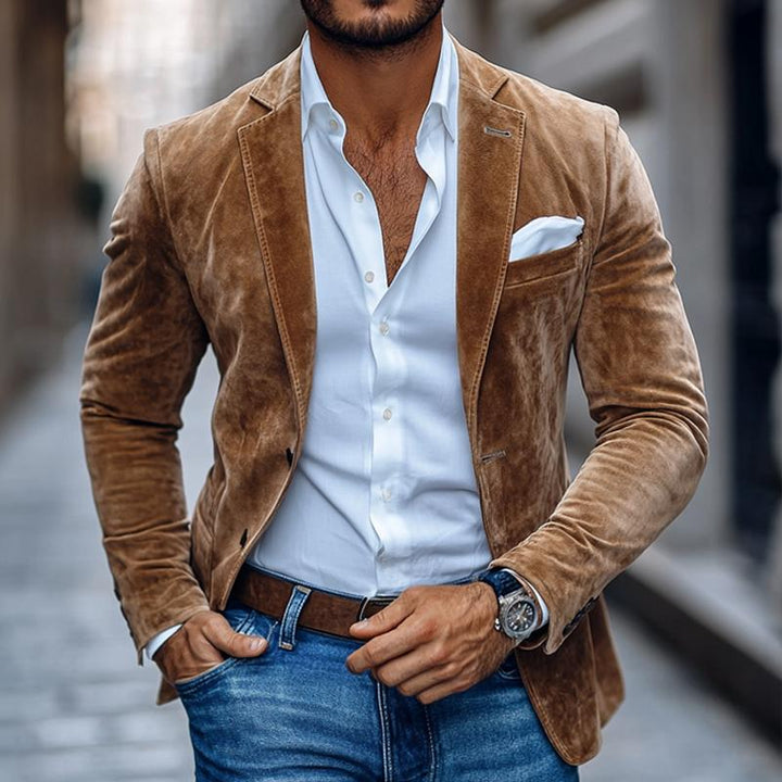 Man wearing brown velvet blazer with white shirt and jeans | Grace Aura