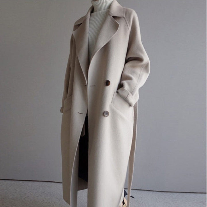 Beige oversized long coat with belt, worn by woman, turtleneck underneath | Grace Aura
