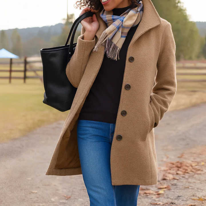 Camel wool trench coat worn by woman with black tote bag outdoors | Grace Aura