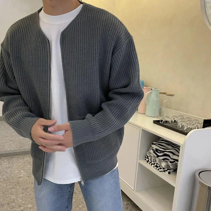 Man wearing gray ribbed knit zip-up cardigan over white t-shirt | Grace Aura