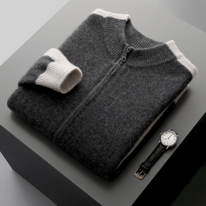 Gray zip-up knit cardigan folded flat beside black leather watch | Grace Aura