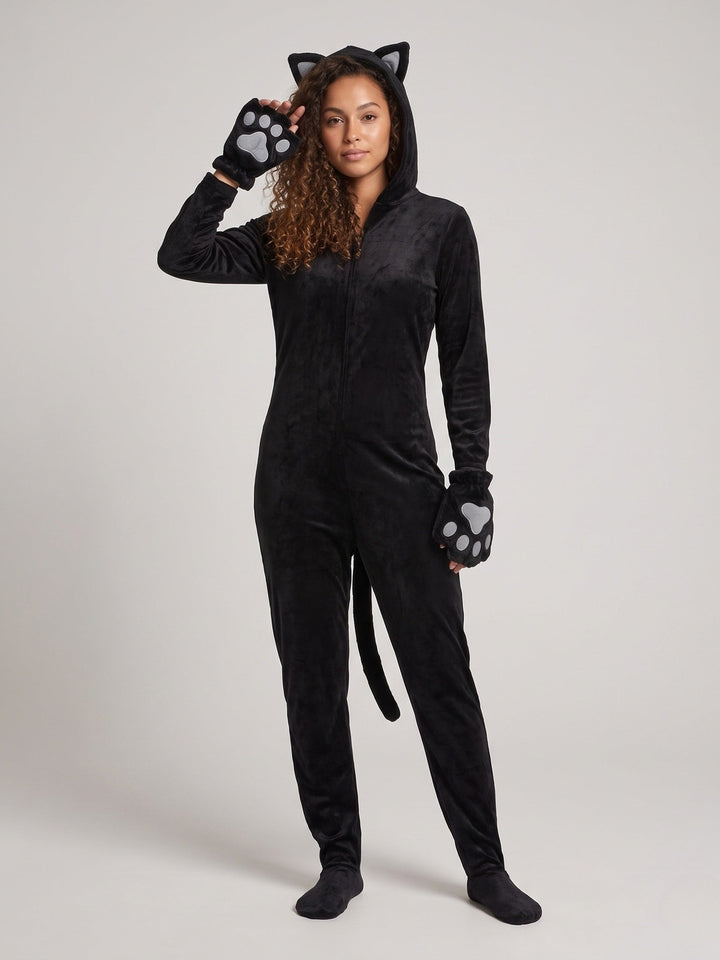 Woman in a black plush cat onesie with hood, ears and paw gloves