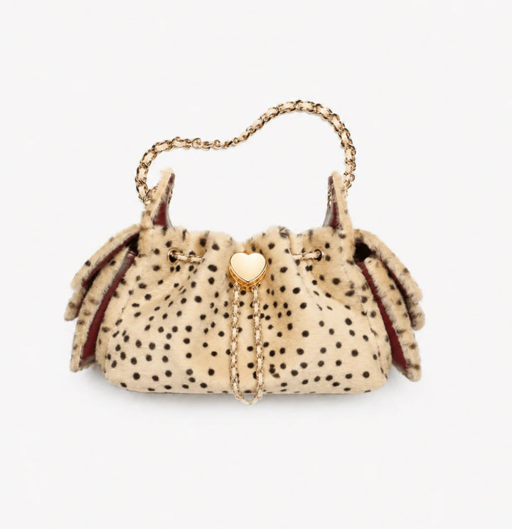 Beige faux fur spotted shoulder bag with gold chain strap, flat lay | Grace Aura
