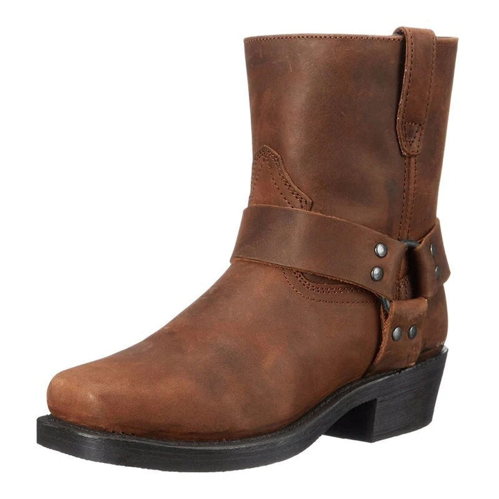 Brown harness boot with buckle strap, block heel, shown standing alone | Grace Aura