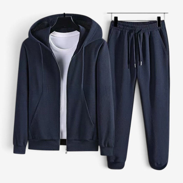Navy blue zip hoodie and jogger set, flat lay display | Grace Aura