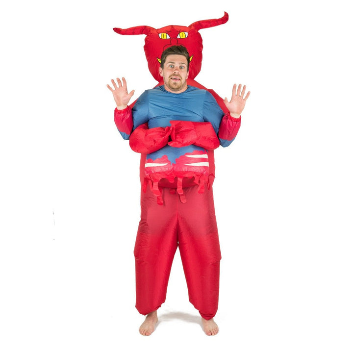 Man wearing red inflatable devil costume with horns and arms raised | Grace Aura