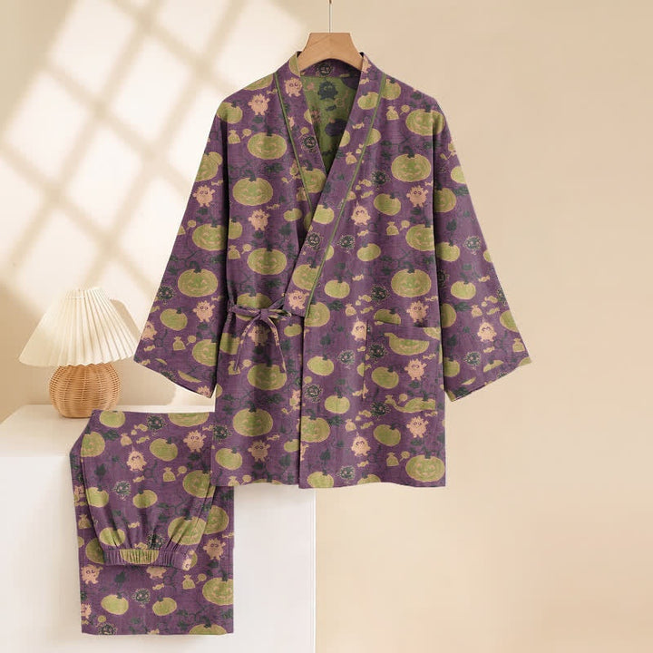 Purple kimono pyjama set with pumpkin print, hung on wooden hanger | Grace Aura