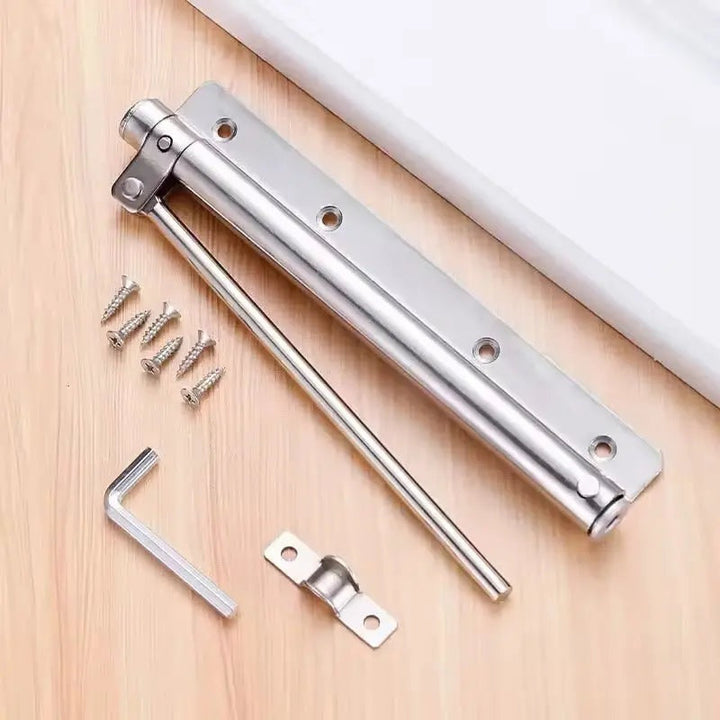 Silver door closer bar with screws and hex key, flat lay | Grace Aura