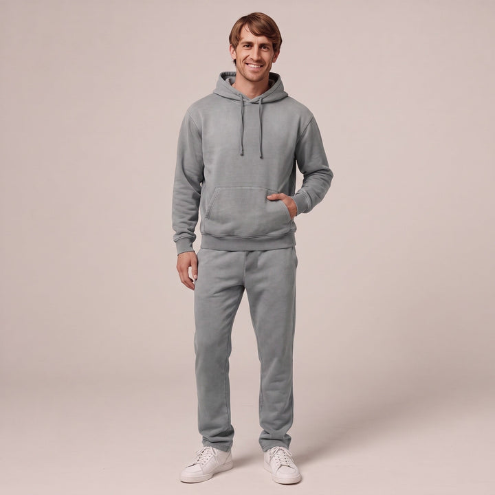 Man wearing grey hoodie and matching joggers, full outfit shown | Grace Aura