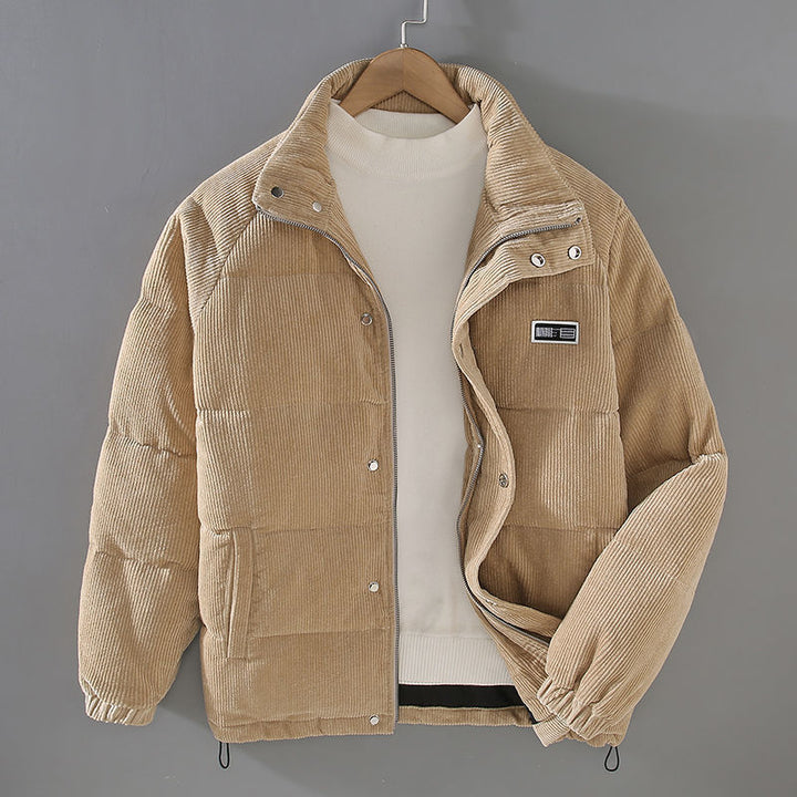Beige corduroy puffer jacket on hanger with cream sweater underneath | Grace Aura