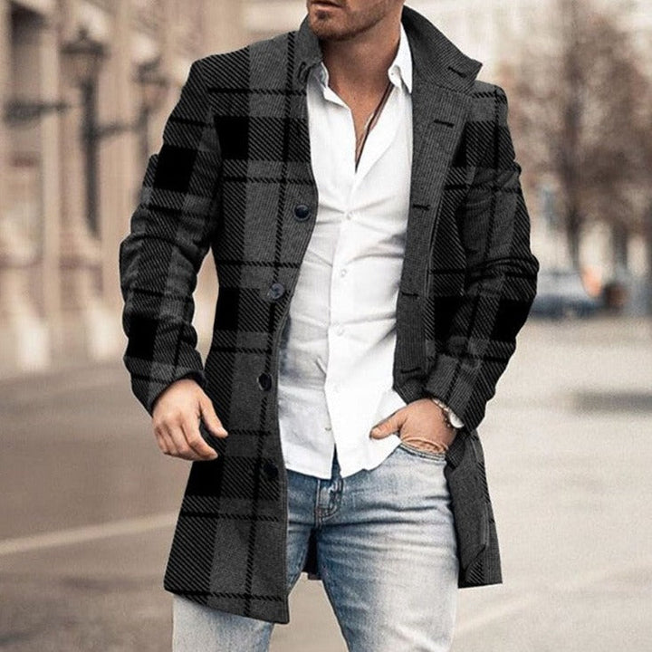 Man wearing black and gray plaid single-breasted wool overcoat outdoors | Grace Aura