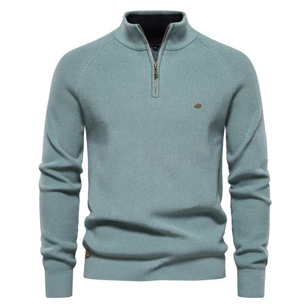 Sage green knitted quarter-zip sweater with stand collar, worn by model | Grace Aura