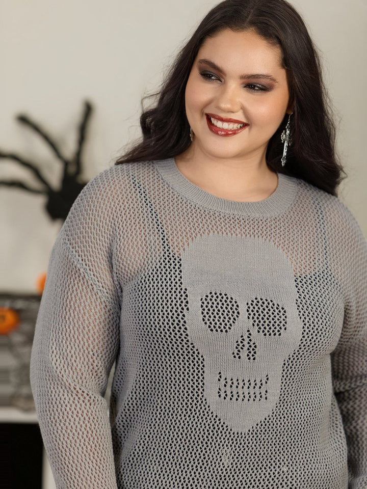 Woman in the grey open knit skull jumper at a Halloween party