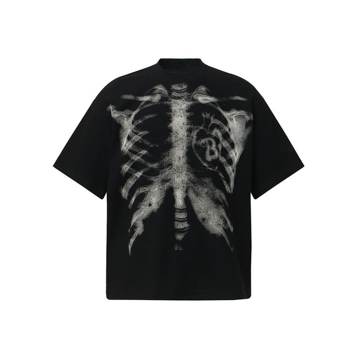 Black oversized t-shirt with distressed skeletal rib cage print, shown flat | Grace Aura