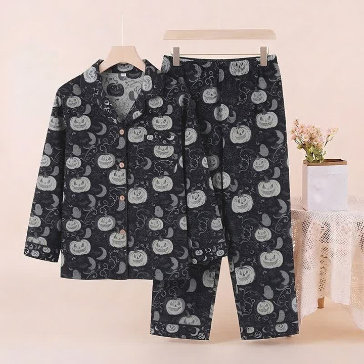 Black pyjama set with pumpkin and moon print on hanger | Grace Aura