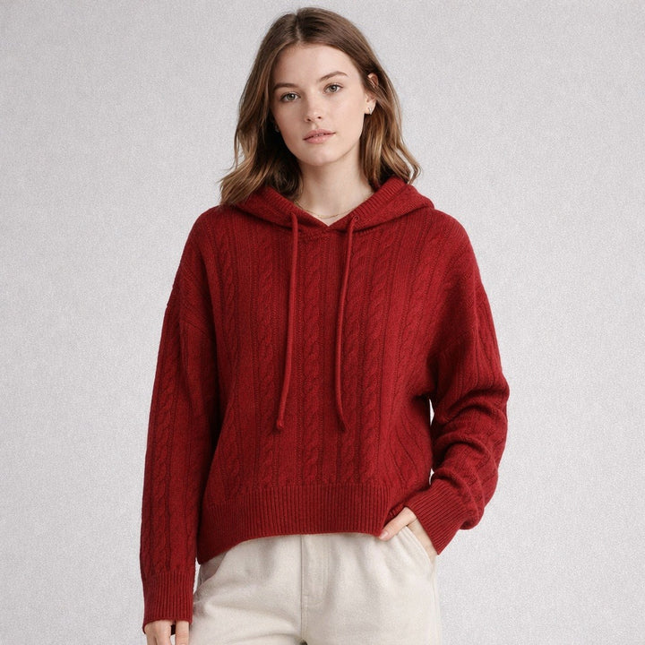 Woman in a red cable knit hoodie
