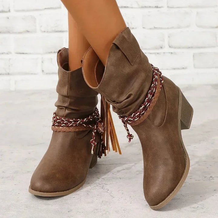 Brown suede slouch cowboy boots with braided fringe strap, worn by model | Grace Aura