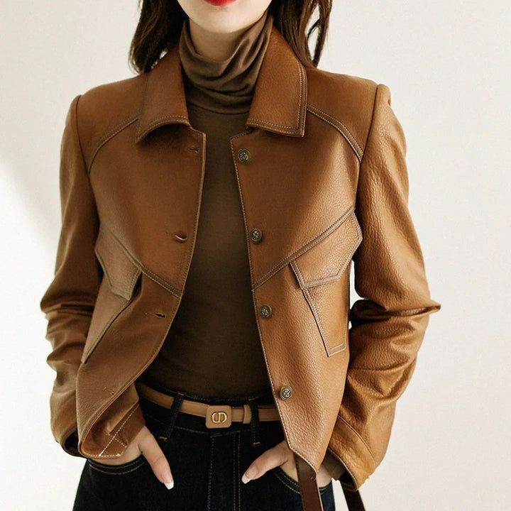 Woman in a cropped brown leather-look jacket with chest pockets