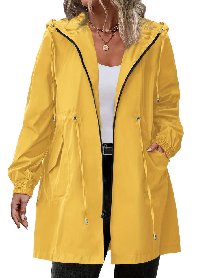 Yellow hooded rain jacket with drawstring waist