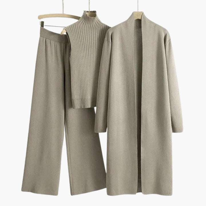 Taupe three-piece knitted co-ord with a sleeveless roll-neck top, wide-leg trousers and a long cardigan on hangers