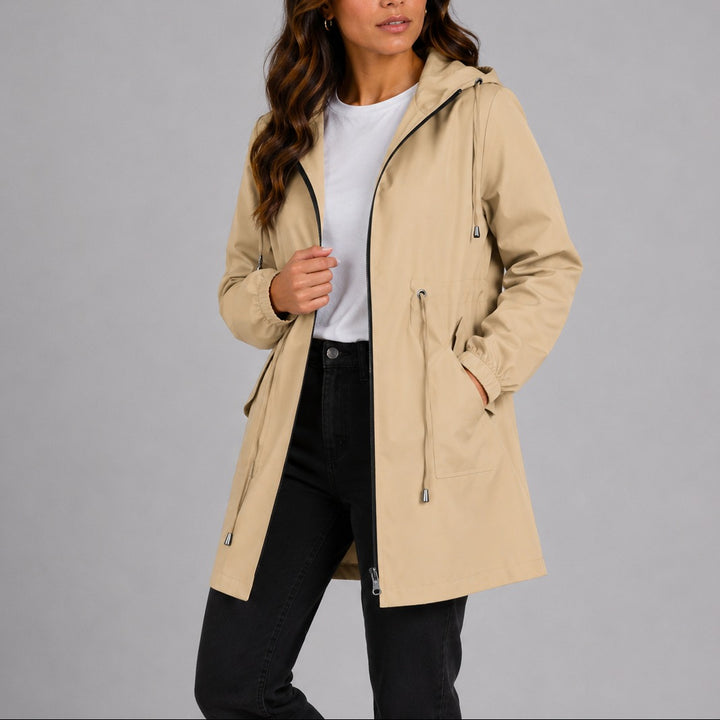 Woman wearing the Beige hooded raincoat with drawstring waist