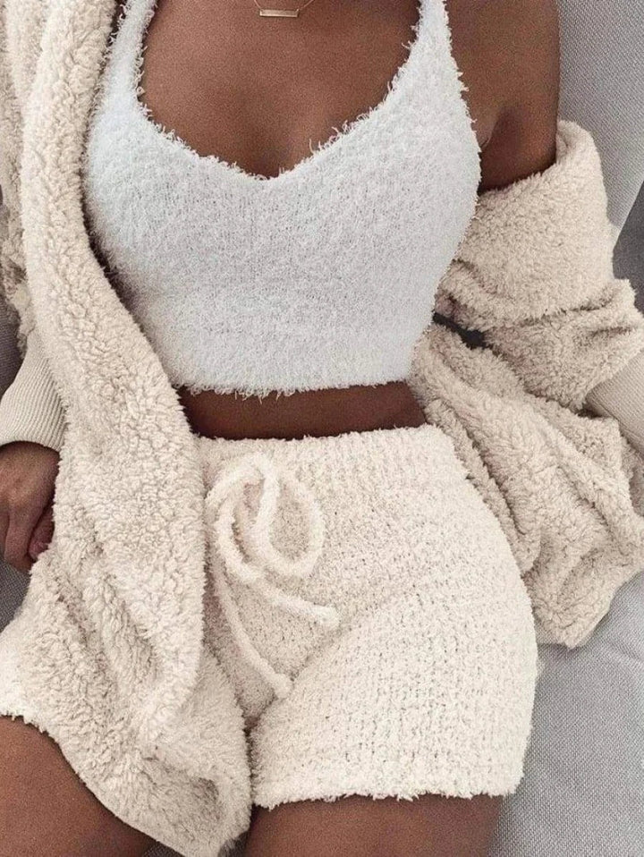Woman wearing white fluffy crop top, matching shorts, and beige cardigan | Grace Aura