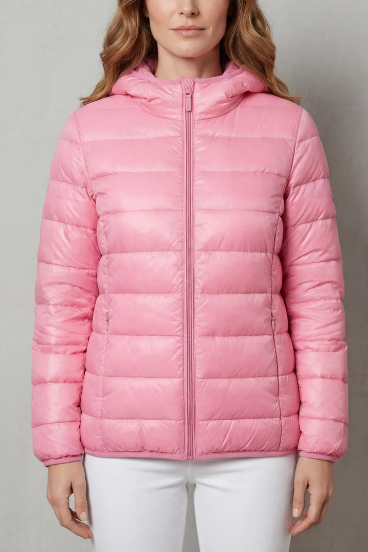 Pink hooded puffer jacket for women with a zip, front view
