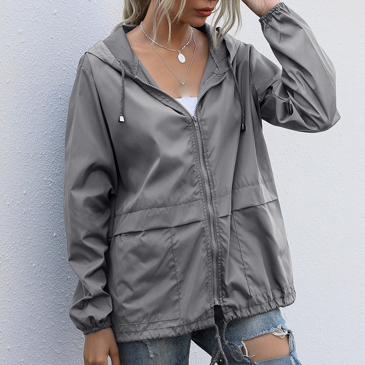 Grey lightweight waterproof rain jacket with hood and drawstring hem
