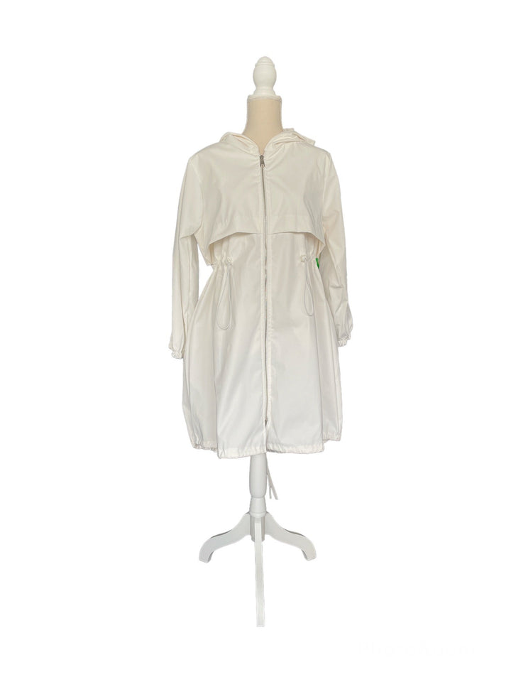 White hooded raincoat with drawstring waist on a dress form