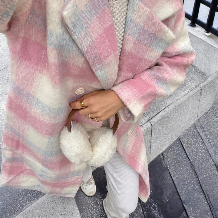 Pink and cream plaid oversized wool coat worn on woman with fluffy bag | Grace Aura