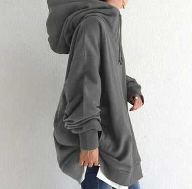Gray oversized longline zip-up hoodie worn by woman, side view | Grace Aura